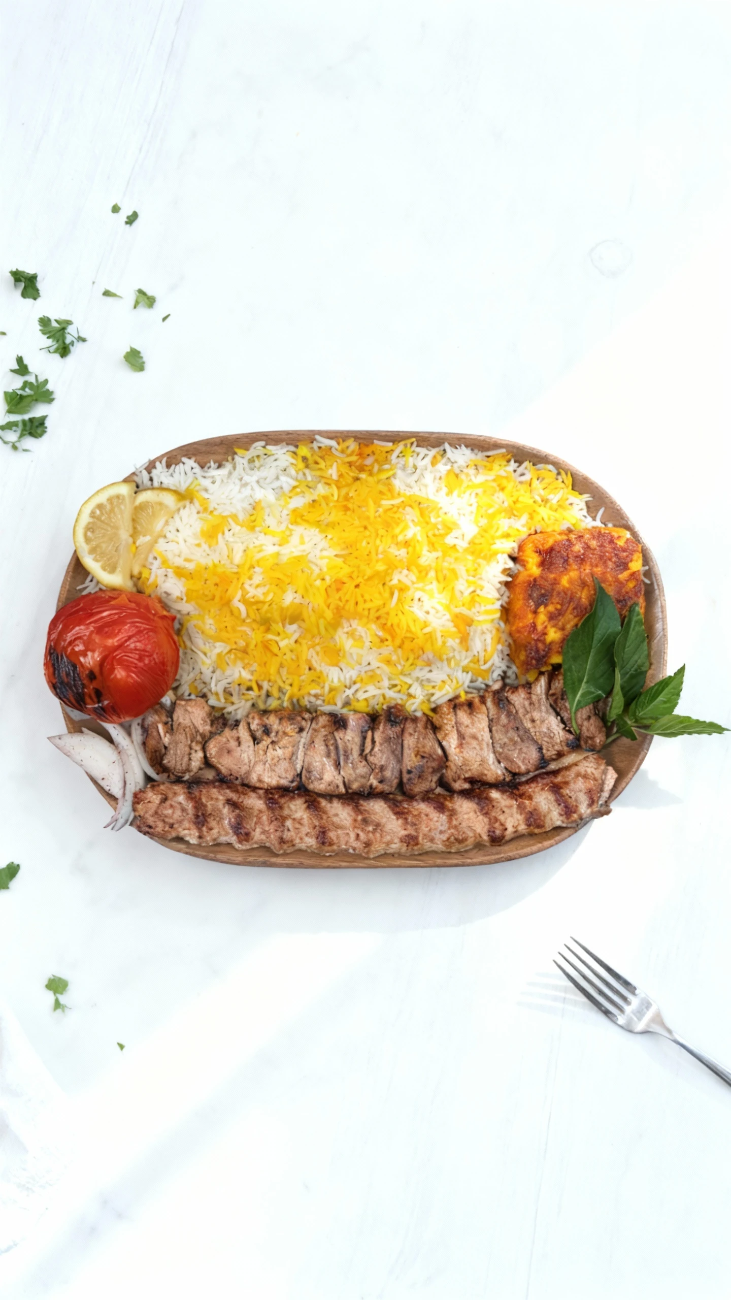 Grilled marinated meat (kebab) is served alongside a generous portion of white and saffron-infused rice on an oval wooden platter. The dish is garnished with a
