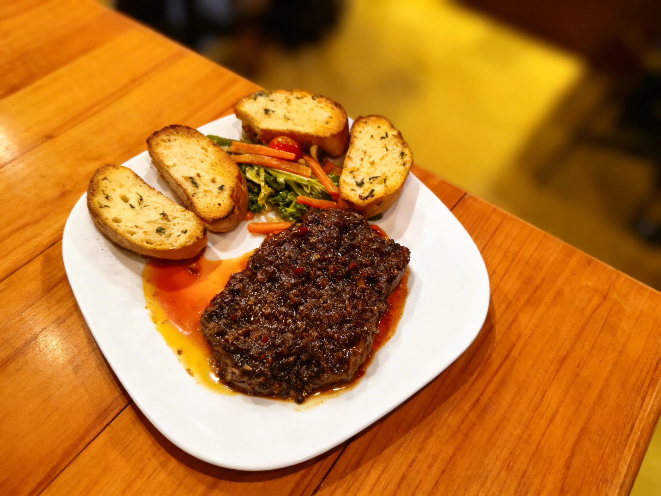 A thick steak heavily coated in a dark peppercorn sauce, served with four slices of toasted herb bread and a side of sautéed vegetables.
