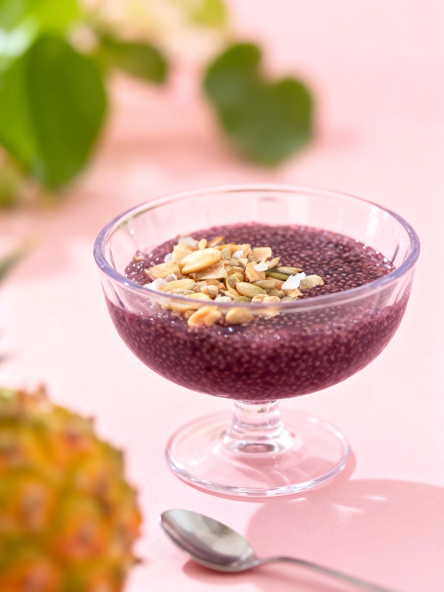 Acai chia seed pudding topped with roasted peanuts, sunflower seeds, and coconut flakes.