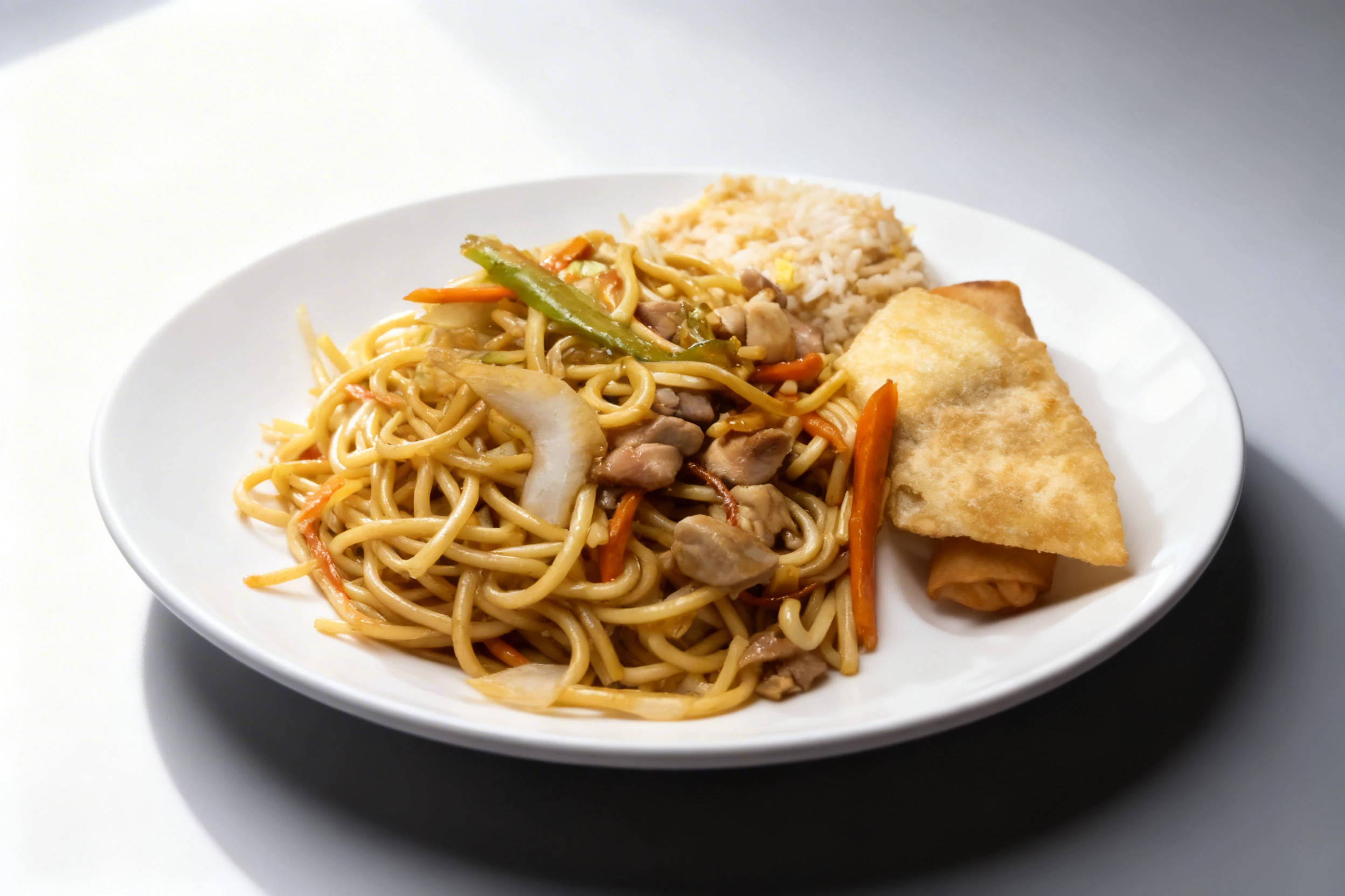 Stir-fried chicken chow mein with sliced carrots and green peppers, served alongside egg fried rice and a golden-brown egg roll.