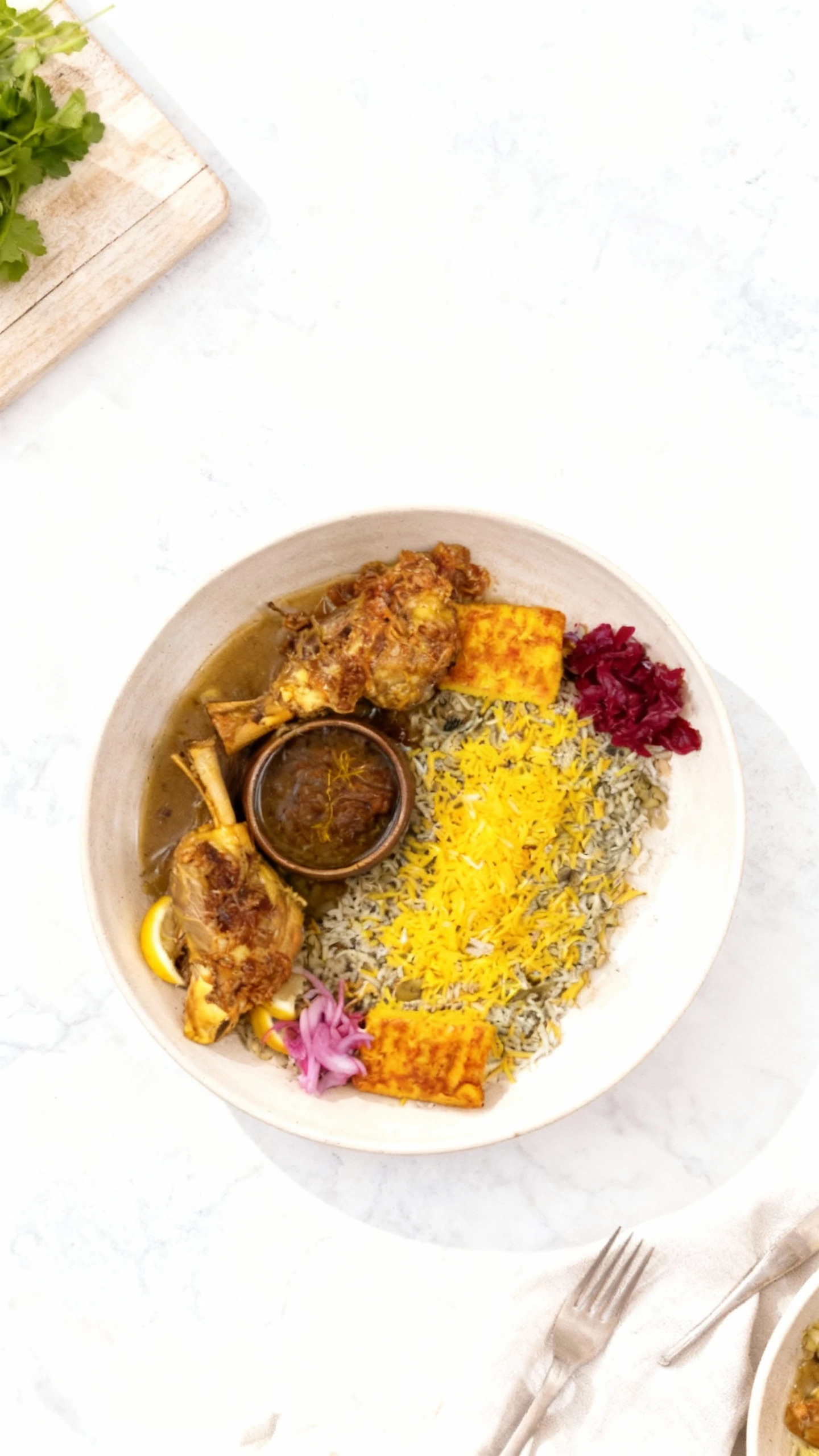 Persian/Iranian meal presented on two wooden platters, featuring two braised lamb shanks topped with crispy onions and served with a side of savory sauce. The a