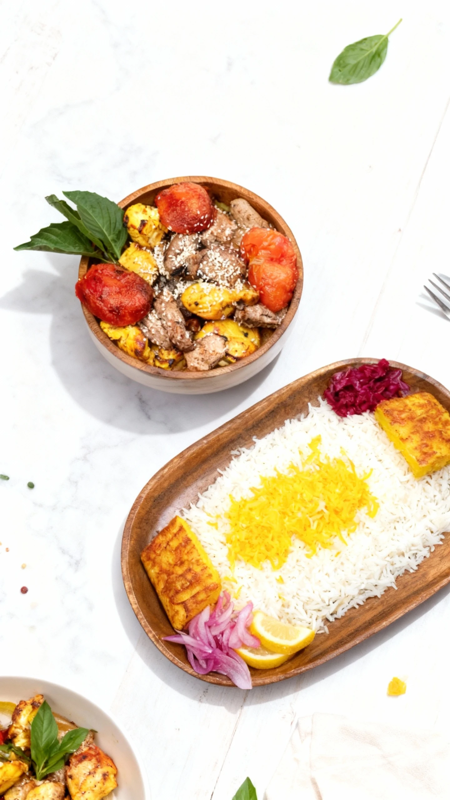 An Iranian meal featuring steamed white rice topped with saffron rice, served on a wooden platter with two pieces of tahdig, lemon wedges, and pickled onions. T