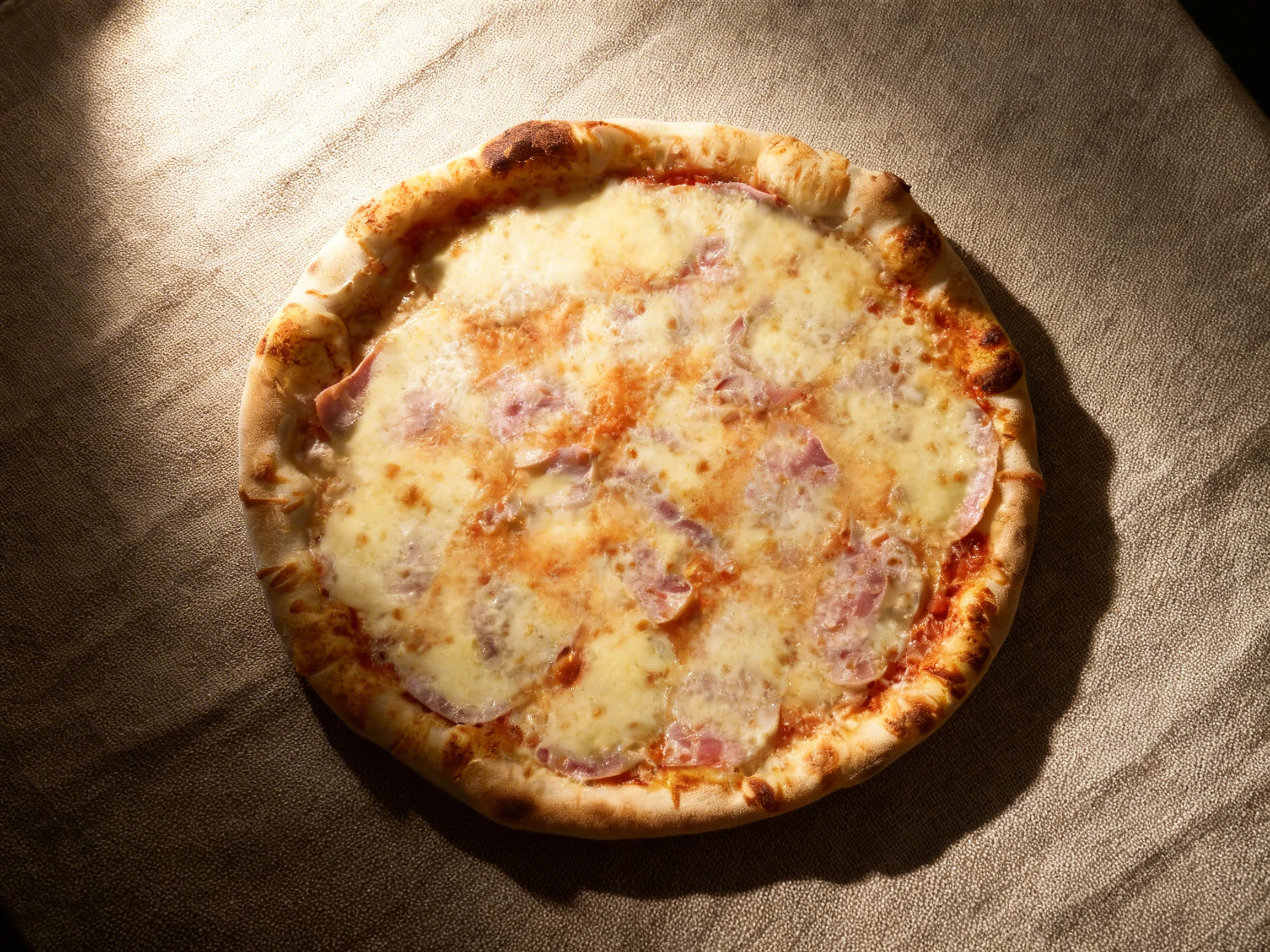 Thin-crust pizza topped with melted mozzarella cheese, tomato sauce, and slices of ham.