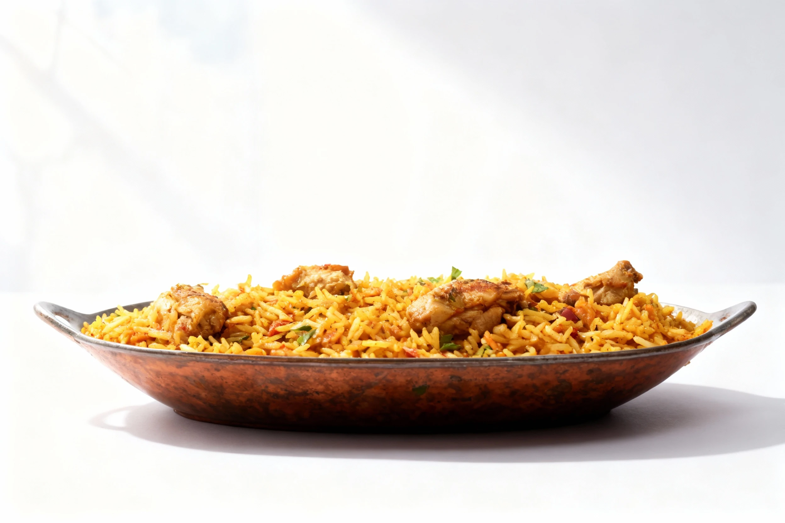 Chicken Biryani made with spiced basmati rice and chunks of chicken, packed in a single-serving ready meal container.