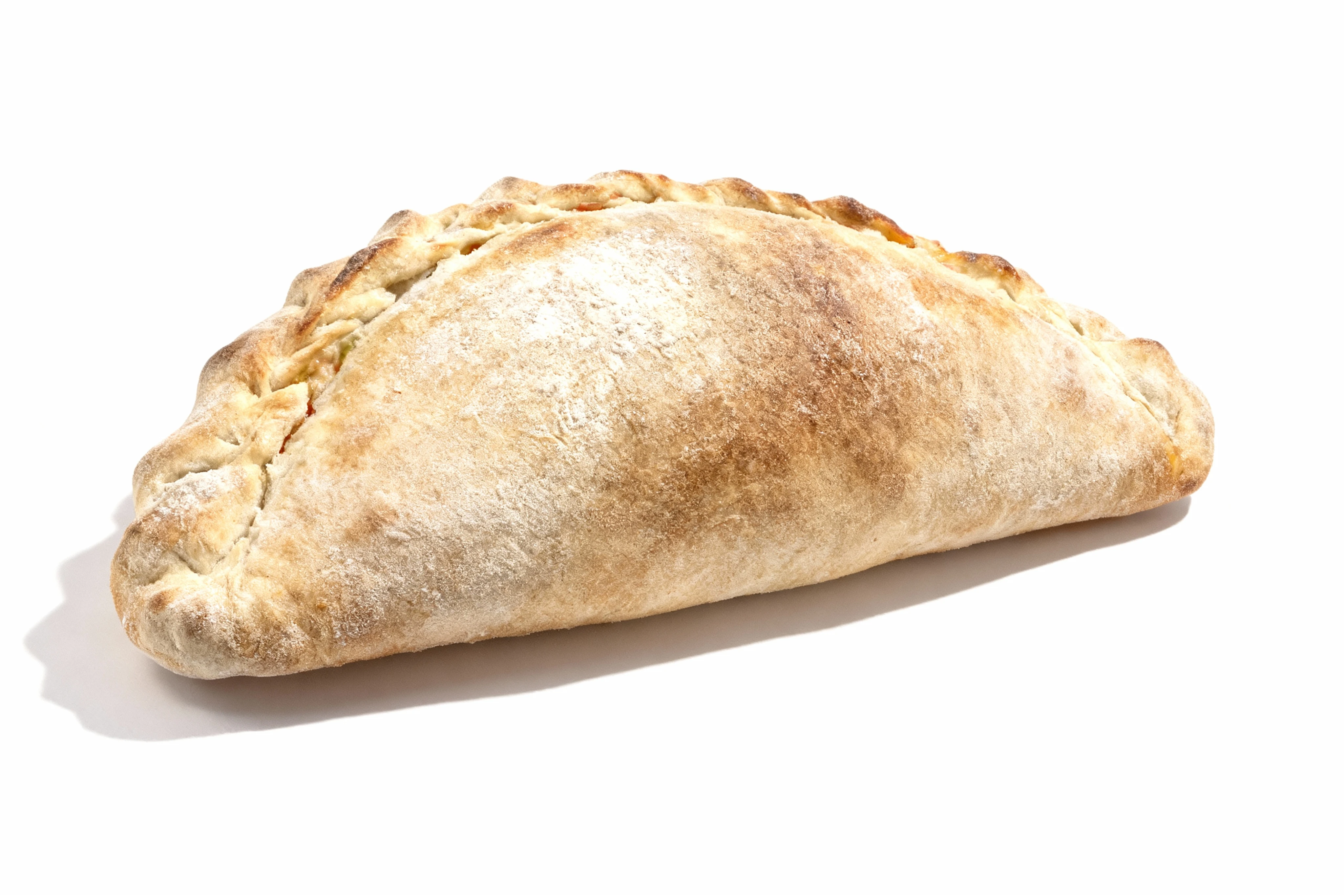 A golden-brown baked calzone or pasty featuring a crimped dough edge and a dusted flour topping.