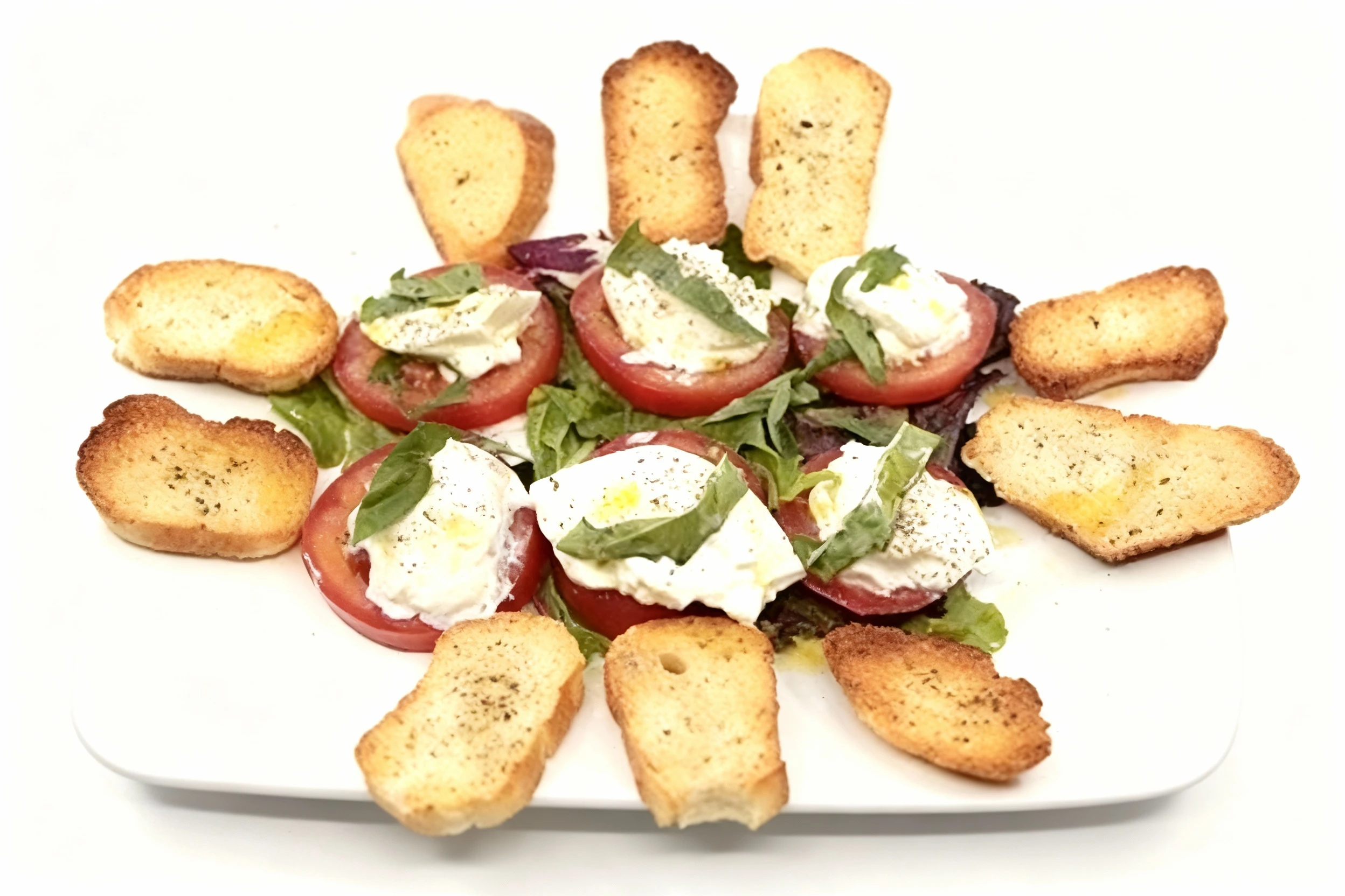 Caprese salad featuring sliced tomatoes topped with fresh mozzarella, basil leaves, and cracked black pepper, served on a bed of mixed greens and surrounded by